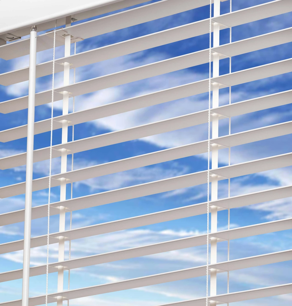 Manufacturer close-up showing the tilt wand and flat lift bands between white faux wood slats