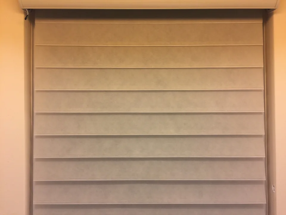 Warm neutral Vienna shade with three-inch horizontal fabric vanes shown closed